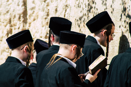 Jerusalem Israel June 19, 2019 View of unknown orthodox Israeli man praying at the Western wall in the Old city of Jerusalem in the afternoonのeditorial素材