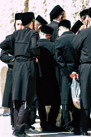 Jerusalem Israel June 19, 2019 View of unknown orthodox Israeli man praying at the Western wall in the Old city of Jerusalem in the afternoonのeditorial素材