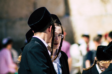 Jerusalem Israel June 19, 2019 View of unknown orthodox Israeli man dancing front the Western wall in the Old city of Jerusalem in the afternoonのeditorial素材