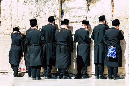 Jerusalem Israel June 19, 2019 View of unknown orthodox Israeli man praying at the Western wall in the Old city of Jerusalem in the afternoonのeditorial素材