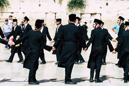 Jerusalem Israel June 19, 2019 View of unknown orthodox Israeli man dancing front the Western wall in the Old city of Jerusalem in the afternoonのeditorial素材