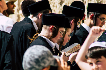 Jerusalem Israel June 19, 2019 View of unknown orthodox Israeli man praying at the Western wall in the Old city of Jerusalem in the afternoonのeditorial素材