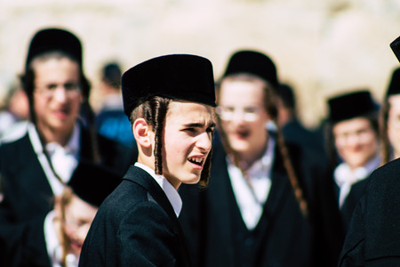 Jerusalem Israel June 19, 2019 View of unknown orthodox Israeli man dancing front the Western wall in the Old city of Jerusalem in the afternoonのeditorial素材