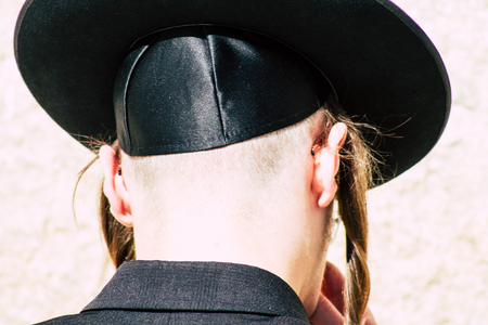 Jerusalem Israel June 19, 2019 View of unknown orthodox Israeli man praying at the Western wall in the Old city of Jerusalem in the afternoonのeditorial素材