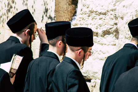 Jerusalem Israel June 19, 2019 View of unknown orthodox Israeli man praying at the Western wall in the Old city of Jerusalem in the afternoonのeditorial素材