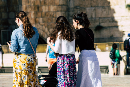 Jerusalem Israel June 19, 2019 View of unknown Israeli woman praying at the Western wall in the Old city of Jerusalem in the afternoonのeditorial素材