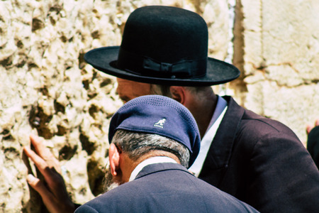 Jerusalem Israel June 19, 2019 View of unknown orthodox Israeli man praying at the Western wall in the Old city of Jerusalem in the afternoonのeditorial素材