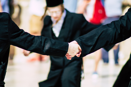 Jerusalem Israel June 19, 2019 View of unknown orthodox Israeli man dancing front the Western wall in the Old city of Jerusalem in the afternoonのeditorial素材