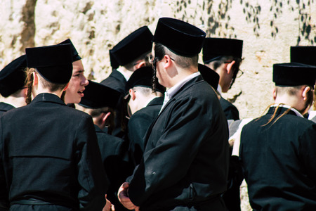 Jerusalem Israel June 19, 2019 View of unknown orthodox Israeli man praying at the Western wall in the Old city of Jerusalem in the afternoonのeditorial素材