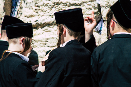 Jerusalem Israel June 19, 2019 View of unknown orthodox Israeli man praying at the Western wall in the Old city of Jerusalem in the afternoonのeditorial素材
