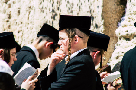 Jerusalem Israel June 19, 2019 View of unknown orthodox Israeli man praying at the Western wall in the Old city of Jerusalem in the afternoonのeditorial素材