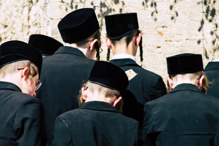 Jerusalem Israel June 19, 2019 View of unknown orthodox Israeli man praying at the Western wall in the Old city of Jerusalem in the afternoonのeditorial素材