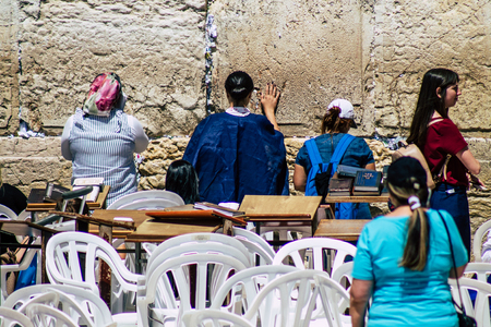 Jerusalem Israel June 19, 2019 View of unknown Israeli woman praying at the Western wall in the Old city of Jerusalem in the afternoonのeditorial素材