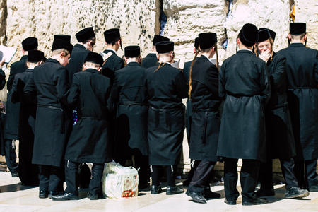 Jerusalem Israel June 19, 2019 View of unknown orthodox Israeli man praying at the Western wall in the Old city of Jerusalem in the afternoonのeditorial素材