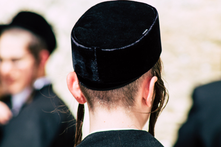 Jerusalem Israel June 19, 2019 View of unknown orthodox Israeli man praying at the Western wall in the Old city of Jerusalem in the afternoonのeditorial素材
