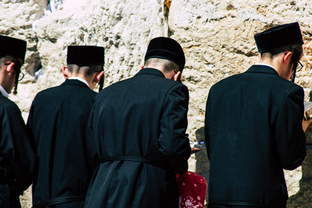 Jerusalem Israel June 19, 2019 View of unknown orthodox Israeli man praying at the Western wall in the Old city of Jerusalem in the afternoonのeditorial素材