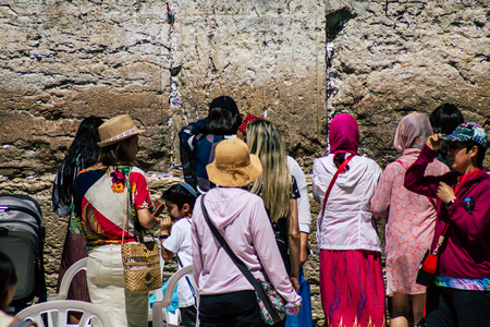 Jerusalem Israel June 19, 2019 View of unknown Israeli woman praying at the Western wall in the Old city of Jerusalem in the afternoonのeditorial素材