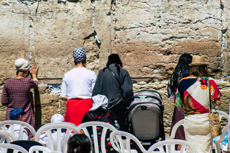 Jerusalem Israel June 19, 2019 View of unknown Israeli woman praying at the Western wall in the Old city of Jerusalem in the afternoonのeditorial素材