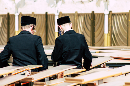 Jerusalem Israel June 19, 2019 View of unknown orthodox Israeli man praying at the Western wall in the Old city of Jerusalem in the afternoonのeditorial素材