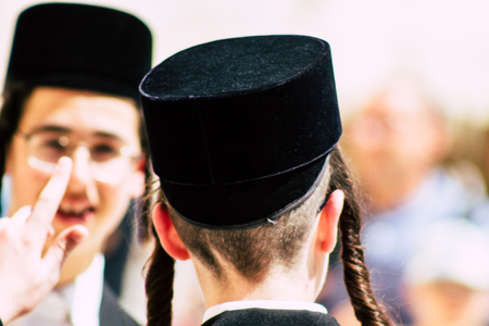 Jerusalem Israel June 19, 2019 View of unknown orthodox Israeli man praying at the Western wall in the Old city of Jerusalem in the afternoonのeditorial素材
