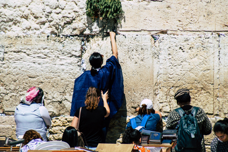 Jerusalem Israel June 19, 2019 View of unknown Israeli woman praying at the Western wall in the Old city of Jerusalem in the afternoonのeditorial素材