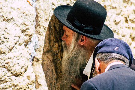 Jerusalem Israel June 19, 2019 View of unknown orthodox Israeli man praying at the Western wall in the Old city of Jerusalem in the afternoonのeditorial素材