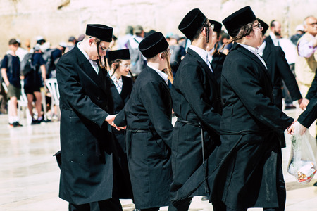 Jerusalem Israel June 19, 2019 View of unknown orthodox Israeli man dancing front the Western wall in the Old city of Jerusalem in the afternoonのeditorial素材