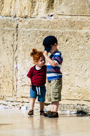 Jerusalem Israel June 19, 2019 View of young Israeli kid walking front the Western wall in the Old city of Jerusalem in the afternoonのeditorial素材