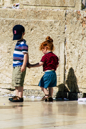 Jerusalem Israel June 19, 2019 View of young Israeli kid walking front the Western wall in the Old city of Jerusalem in the afternoonのeditorial素材
