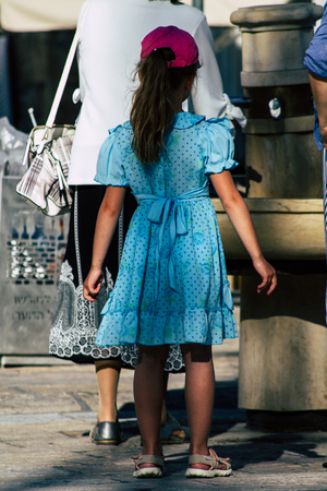 Jerusalem Israel June 19, 2019 View of young Israeli girl walking front the Western wall in the Old city of Jerusalem in the afternoonのeditorial素材