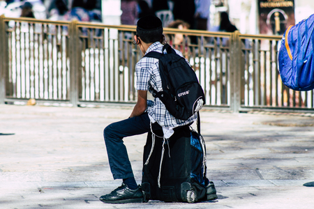 Jerusalem Israel June 19, 2019 View of young Israeli kid walking front the Western wall in the Old city of Jerusalem in the afternoonのeditorial素材