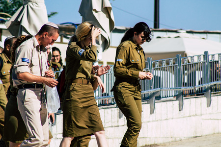 Jerusalem Israel June 19, 2019 View of Israeli soldier visiting the Western wall at the Old city of Jerusalem in the afternoonのeditorial素材