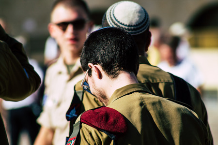 Jerusalem Israel June 19, 2019 View of Israeli soldier visiting the Western wall at the Old city of Jerusalem in the afternoonのeditorial素材