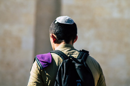 Jerusalem Israel June 19, 2019 View of Israeli soldier visiting the Western wall at the Old city of Jerusalem in the afternoonのeditorial素材