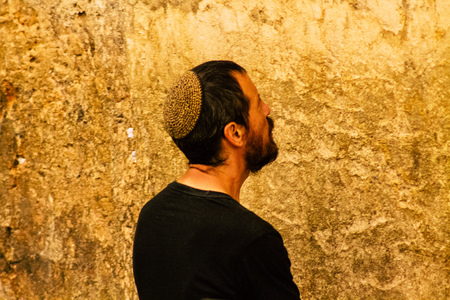 Jerusalem Israel June 19, 2019 View of unknown people praying at the Western wall in the Old city of Jerusalem in the afternoonのeditorial素材