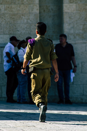 Jerusalem Israel June 19, 2019 View of Israeli soldier visiting the Western wall at the Old city of Jerusalem in the afternoonのeditorial素材