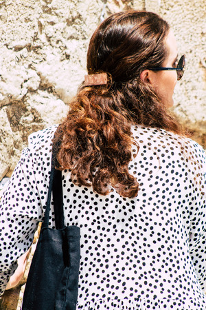 Jerusalem Israel June 24, 2019 View of unknown Israeli woman praying at the Western wall in the Old city of Jerusalem in the afternoonのeditorial素材