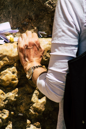 Jerusalem Israel June 24, 2019 View of unknown Israeli woman praying at the Western wall in the Old city of Jerusalem in the afternoonのeditorial素材
