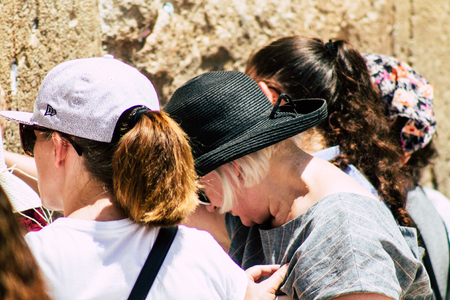 Jerusalem Israel June 24, 2019 View of unknown Israeli woman praying at the Western wall in the Old city of Jerusalem in the afternoonのeditorial素材