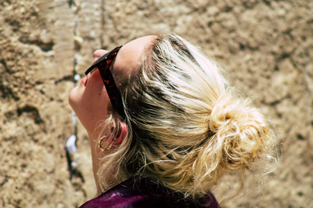 Jerusalem Israel June 24, 2019 View of unknown Israeli woman praying at the Western wall in the Old city of Jerusalem in the afternoonのeditorial素材