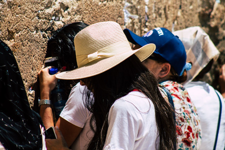 Jerusalem Israel June 24, 2019 View of unknown Israeli woman praying at the Western wall in the Old city of Jerusalem in the afternoonのeditorial素材