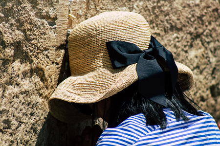 Jerusalem Israel June 24, 2019 View of unknown Israeli woman praying at the Western wall in the Old city of Jerusalem in the afternoonのeditorial素材