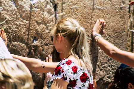Jerusalem Israel June 24, 2019 View of unknown Israeli woman praying at the Western wall in the Old city of Jerusalem in the afternoonのeditorial素材