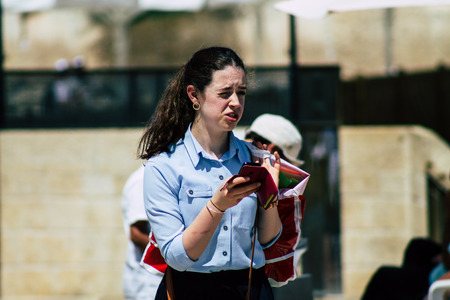 Jerusalem Israel June 24, 2019 View of unknown orthodox Israeli woman walking front the Western wall in the Old city of Jerusalem in the afternoonのeditorial素材