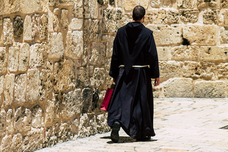 Jerusalem Israel June 24, 2019 View of unknown Catholic priest walking front the holy church in the...