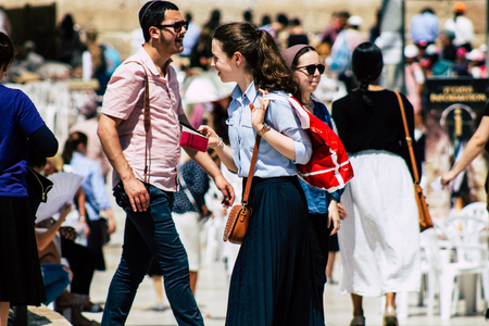 Jerusalem Israel June 24, 2019 View of unknown orthodox Israeli woman walking front the Western wall in the Old city of Jerusalem in the afternoonのeditorial素材