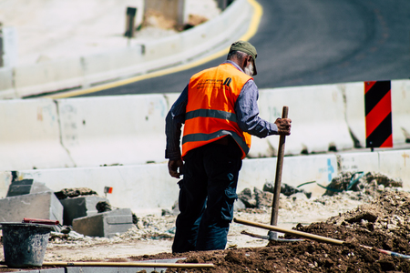 Jerusalem Israel June 24, 2019 View of worker building a new road in Jerusalem in the afternoonのeditorial素材