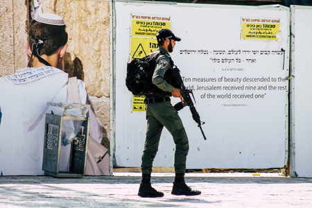 Jerusalem Israel July 2, 2019 View of Israeli police walking front the Western wall at the Old city of Jerusalem in the afternoonのeditorial素材