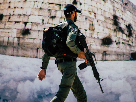 Jerusalem Israel July 2, 2019 View of Israeli police walking front the Western wall at the Old city of Jerusalem in the afternoonのeditorial素材
