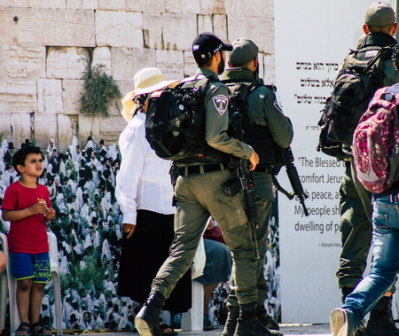 Jerusalem Israel July 2, 2019 View of Israeli police walking front the Western wall at the Old city of Jerusalem in the afternoonのeditorial素材